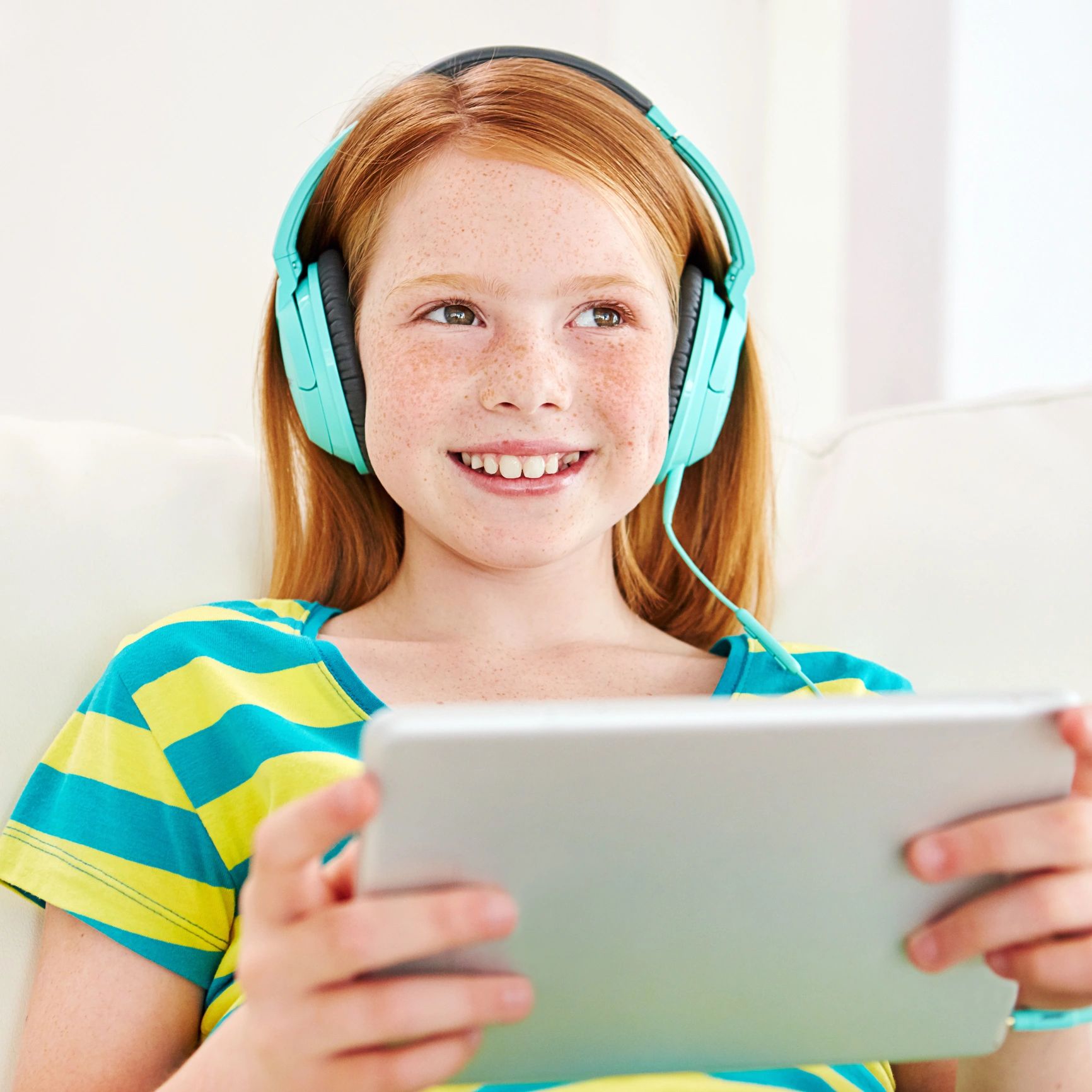 Child enjoying music with headphones